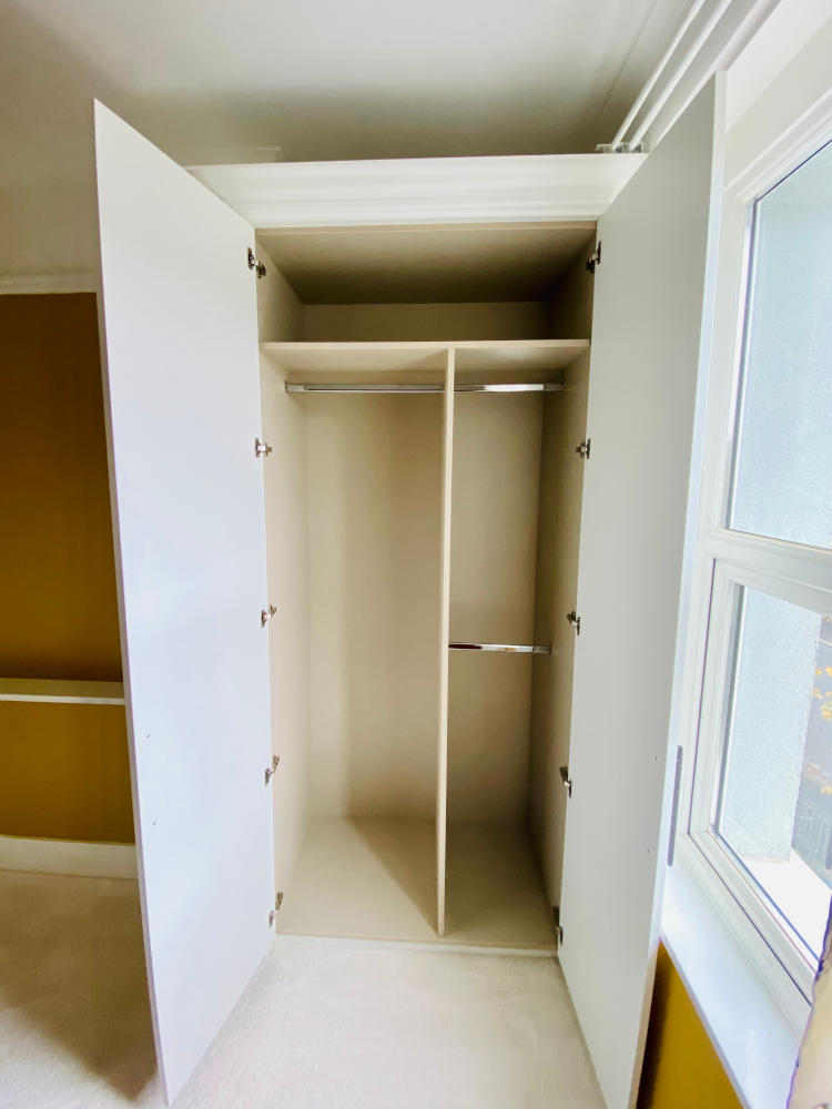 Fitted Wardrobes Plymouth - White Alcove Wardrobe Doors Open - James Hewitt Furniture By Design